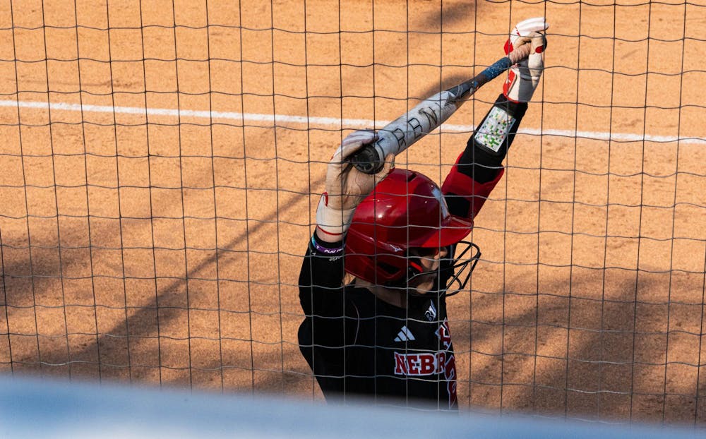 Nebraska player stretching during the MSU V Nebraska Softball game at Secchia Stadium in East Lansing, on March 20 2026.