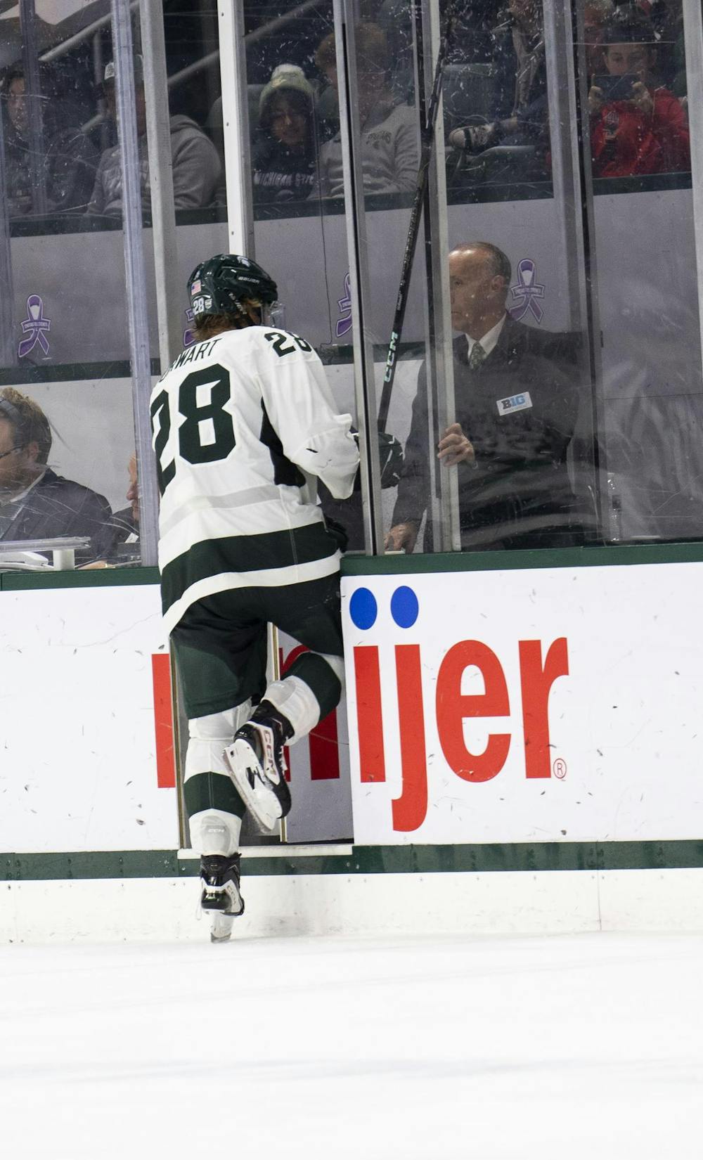 <p>Michigan State University junior forward Karsen Dorwart (28) skates into the penalty box at Munn Ice Arena on Nov. 16, 2024.</p>