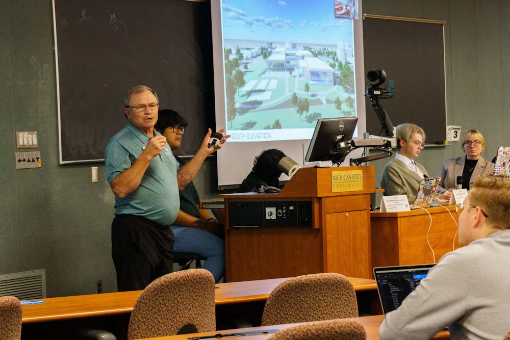 <p>MSU Associate Professor Dr. Rick McNeil presents plans for the new recreational sports facility to the ASMSU representatives on Sept. 22, 2022. This new facility will be constructed in the near future, and replace IM West as the main rec sports facility for MSU students.</p>