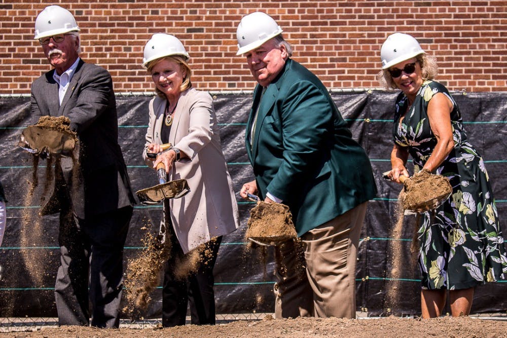 State of Michigan Senator, Darwin Booher, Provost and Executive Vice President for Academic Affairs, June Pierce Youatt, Interim President John Engler and MSU Board of Trustee member Melanie Foster shovel dirt during the official groundbreaking ceremony for the new STEM Teaching and Learning Facility on Aug. 31, 2018 at the former Shaw Lane Power Plant. It will be the first classroom building constructed on Michigan State's campus in almost 50 years and is estimated to be completed in September 2020.