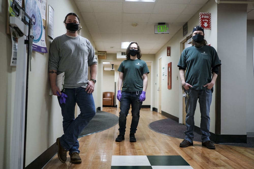 <p>Casey Serr (left), Skylar Ward (middle), and Gabriel Nichols (right) are the third shift janitorial staff at Olin Health Center as well as essential workers during the COVID-19 pandemic on February 3, 2021.</p><p></p>