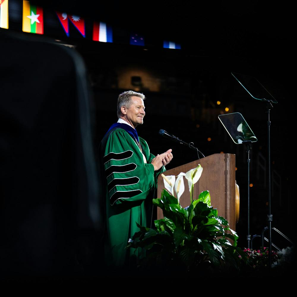 <p>Michigan State's president, Kevin Guskiewicz, gives a round of applause for the class of 2026 after his speech during a convocation inside the Breslin Center in East Lansing, Mich., on May 1, 2026.</p>