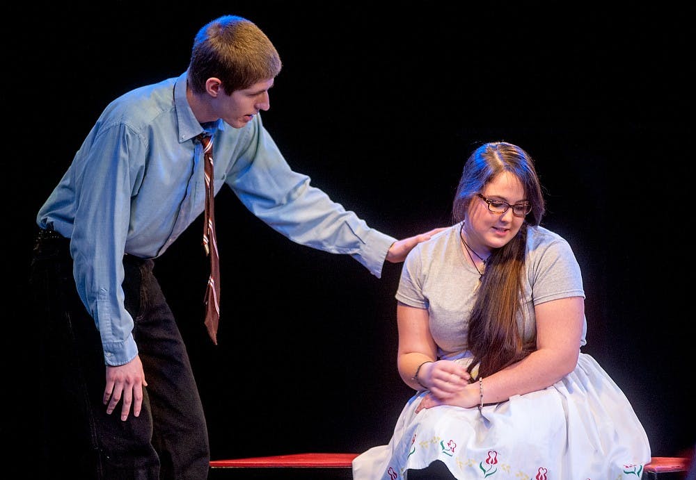 	<p>Chemistry and Spanish junior Stephen McNamara, who plays the man and the dog in the play &#8220;The Story of the Man who Turned into a Dog,&#8221; talks with Spanish senior Hallie LeBlanc de Smith, who played the wife in the play April 18, 2013, at <span class="caps">MSU</span> Auditorium. Justin Wan/The State News</p>