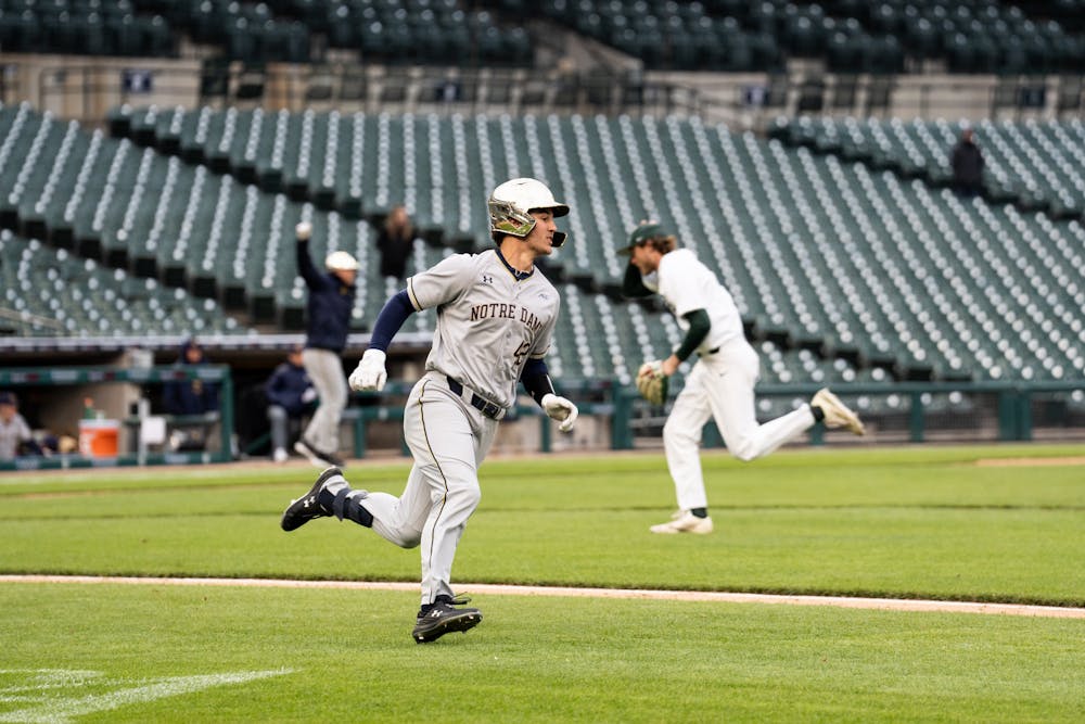 <p>Notre Dame player Brooks Coetzee III races to first base after a hit. The Spartans played the Fighting Irish at Comerica Park on April 26, 2022.</p>