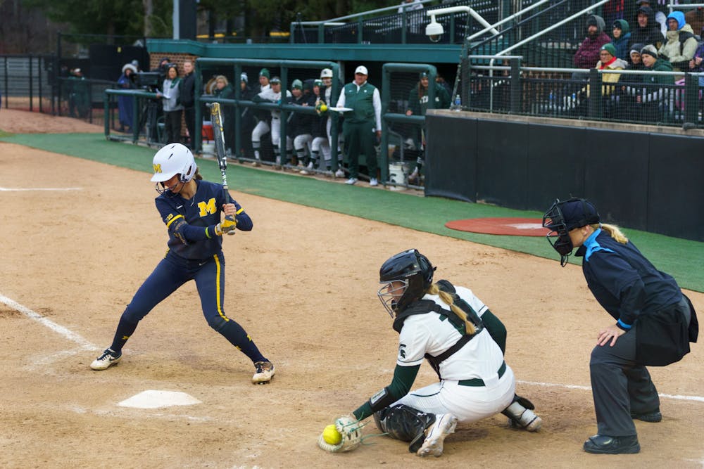 <p>Michigan graduate student Kristina Burkhardt (23) striking then fouling out in the top of the seventh inning. Michigan State lost 3-0 to Michigan at the Secchia Stadium, on April 19, 2022.</p>