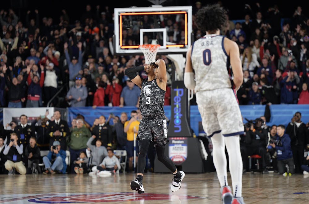 Michigan State sophomore guard Jaden Akins holds his head after missing the potential game-winning shot as the time ran out in regulation, during the 2022 Armed Forces Classic on Nov. 11. The Spartans lost 64-63. 
