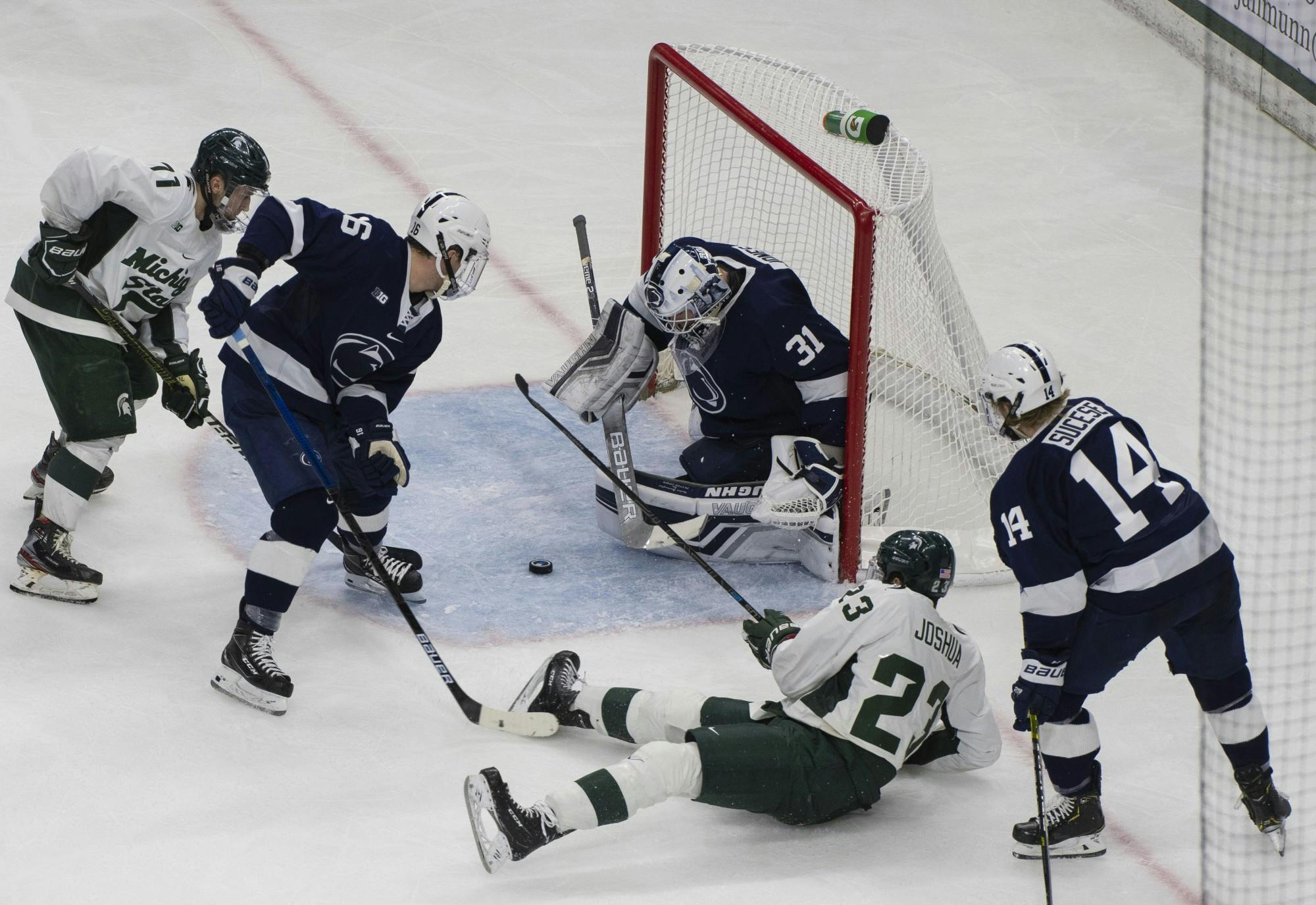 <p>The Spartans fight to get a goal in the third period, with Penn State&#x27;s then-goaltender Peyton Jones guarding it. MSU fell to Penn State, 2-1, on Jan. 25, 2020.</p>