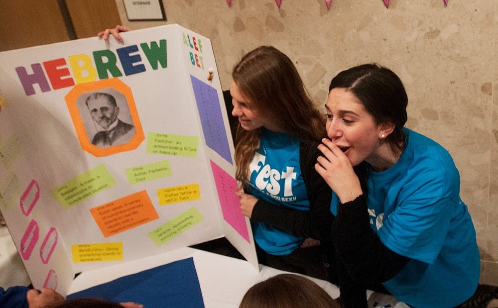 	<p>Freshman Annarose Lemire, left, and James Madison freshman Carly Sternberg, right, explain their booth to the crowd during Israel Fest on Nov. 12, 2013, at the <span class="caps">MSU</span> Union Ballroom. The festival was organized as a way to spread the culture of Israel, and included Israeli music, food, dance and several informative booths. Brian Palmer/The State News</p>