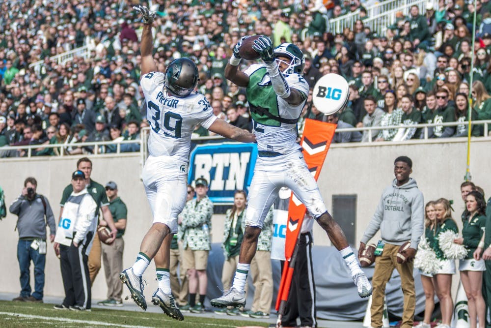 Sophomore wide receiver Justin Layne (2) receives a touchdown pass during the Green and White Spring Game on April 1, 2017 at Spartan Stadium. The White team defeated the Green team, 33-23.