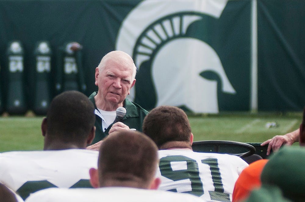 	<p>Former <span class="caps">MSU</span> football head coach from 1983 to 1994, George Perles, talks to the football team before the start of practice Aug. 27, 2013, at the practice field outside Duffy Daugherty Football Building. </p>