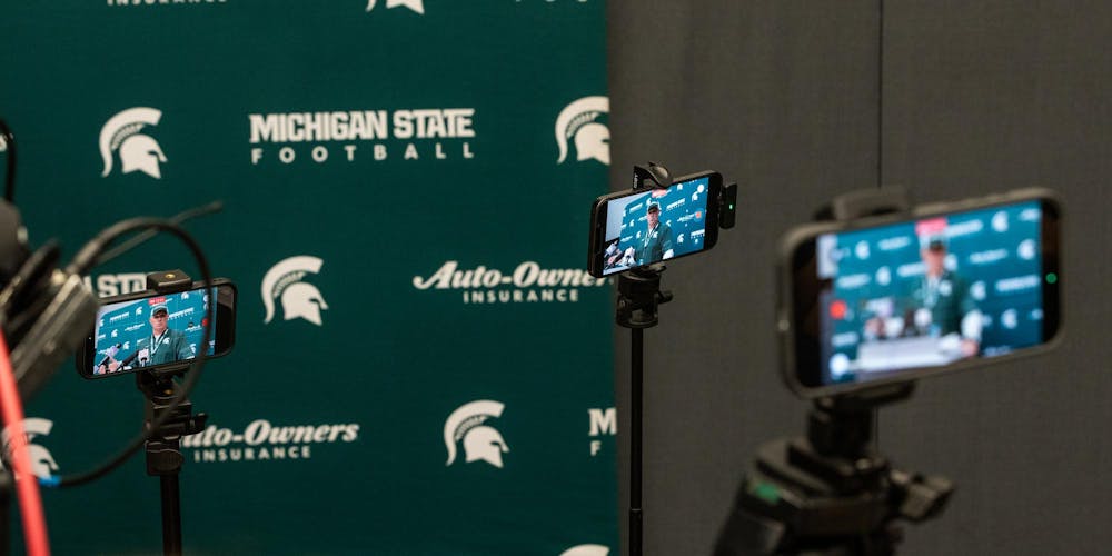 <p>Press members set up their phones to record a press conference with MSU football Head Coach Pat Fitzgerald in the Skandalaris Football building in East Lansing, Mich., on Aug. 6, 2026.</p>