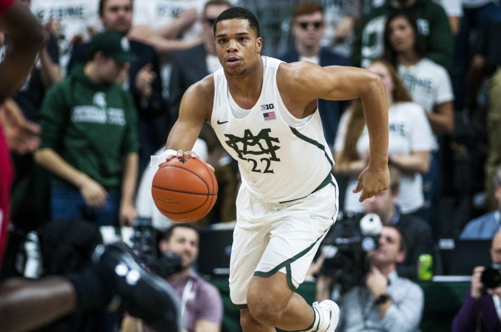 Freshman guard and forward Miles Bridges (22) drives the ball up the court during the first half of the men's basketball game against the University of Wisconsin on Feb. 26, 2017 at Breslin Center. The Spartans defeated the Badgers, 84-74.