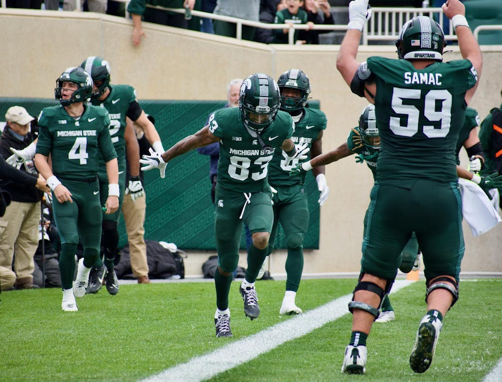 Wide receiver Montorie Foster Jr. (83) celebrates his touchdown during a game against Nebraska at Spartan Stadium on Nov. 4, 2023. The Spartans defeated the Cornhuskers 20-17.