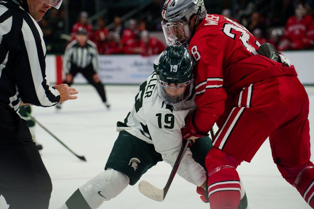 <p>Senior forward Nicholas Muller (19) during a a face off during the first of a two game series against Ohio State, held at Munn Ice Arena on Nov 10, 2022. The Spartans defeated the Buckeyes 4-2.</p>