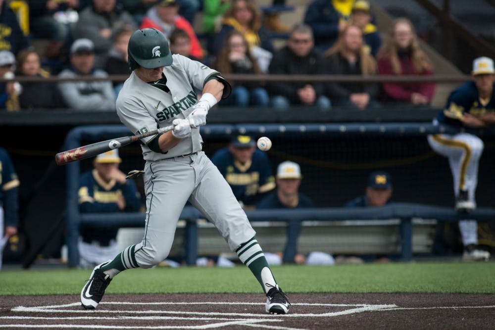 Freshman infielder Marty Bechina (2) swings at the ball during the game against Michigan on April 29, 2016 at Ray Fisher Stadium at Wilpon Baseball Complex in Ann Arbor, Mich. The Spartans were defeated by the Wolverines, 4-3.