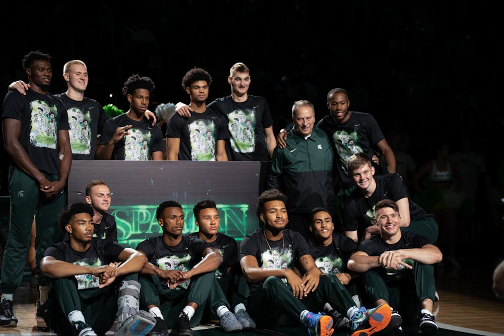 <p>MSU Men&#x27;s Basketball team poses for a group photo with coach Tom Izzo at Midnight Madness, held at the Breslin Center on October 8, 2022.</p>