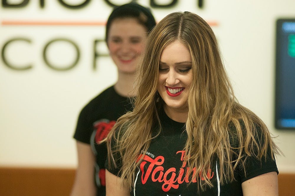 <p>Media and information senior Laura Swanson smiles as she dances in a flash mob with fellow cast members of "The Vagina Monologues" Feb. 14, 2015, at the MSU Union. The cast said they will preform the play Feb. 27 and Feb. 28. at Wharton Center. Kelsey Feldpausch/The State News</p>