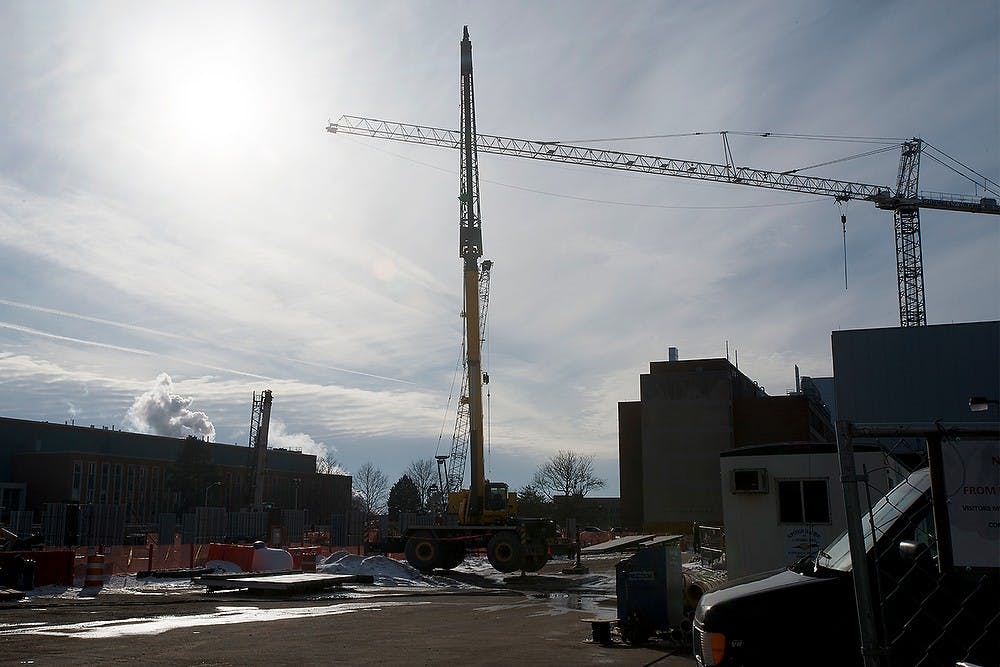 <p>The Facility for Rare Isotope Beams undergoes construction using giants cranes Feb. 25, 2015, at The FRIB off of Wilson Rd. Erin Hampton/The State News</p>