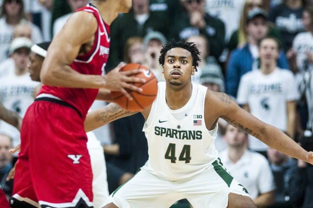 Freshman forward Nick Ward (44) covers Youngstown State forward Devin Haygood (2) during the second half of the men's basketball game against Youngstown State on Dec. 6, 2016 at Breslin Center. The Spartans defeated the Penguins, 77-57.