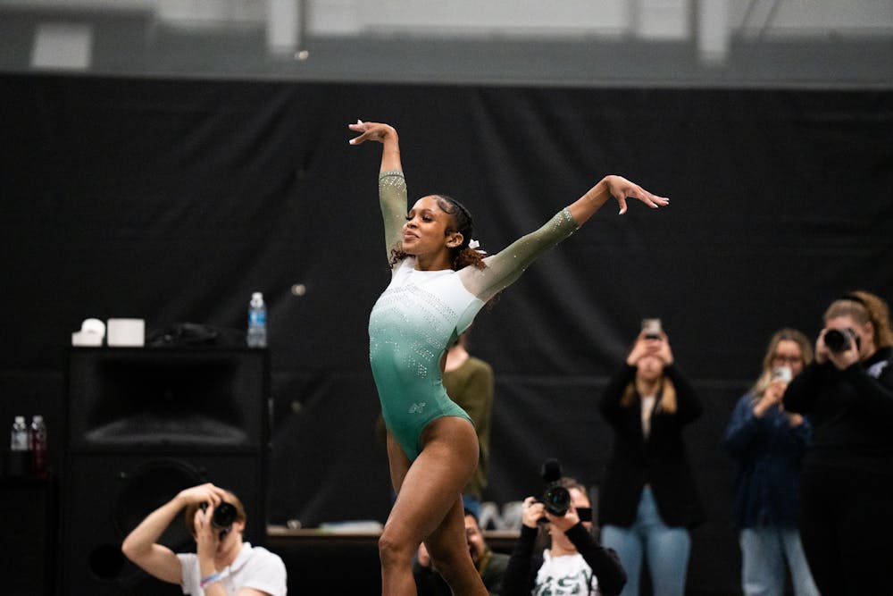 <p>Senior All-Around Nikki Smith after finishing her dismount at the MSU vs. Penn State meet at the Jenison Field House on Feb. 4, 2023. The Spartans beat the Nittany Lions 197.450 - 195.475.</p>