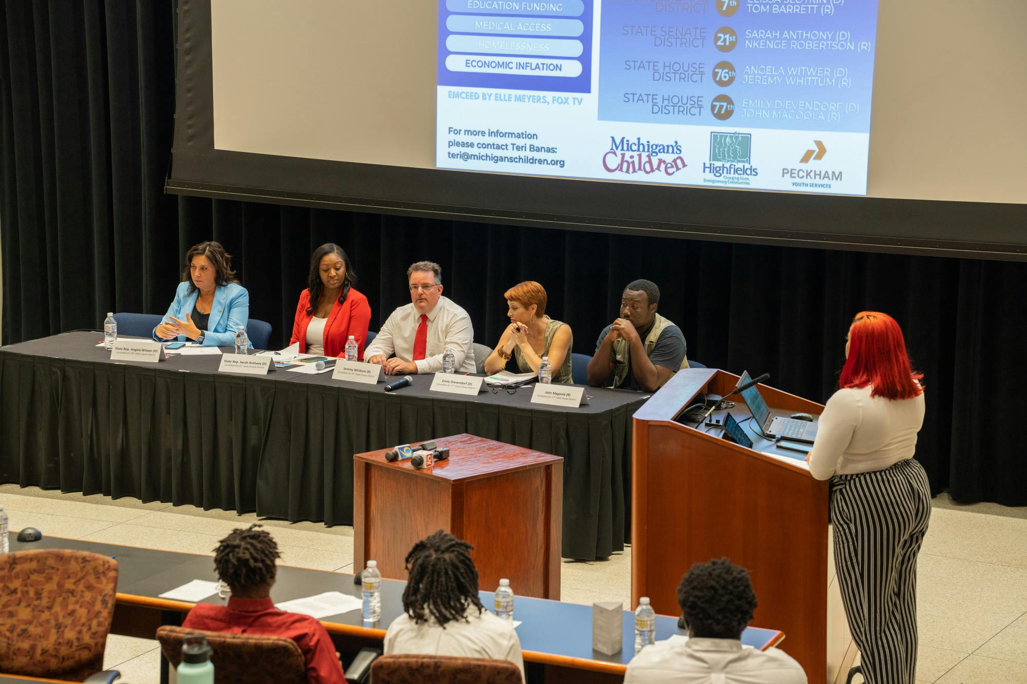 Local candidates for state office (L-R) Rep. Angela Witwer (D-Delta Township), Rep. Sarah Anthony (D-Lansing), Jeremy Whittum, Emily Dievendorf and John Magoola listen as a participant asks them a question at Lansing Community College on Sept. 19, 2022.