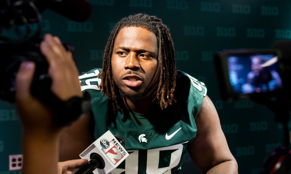 <p>Senior defensive tackle Raequan Williams speaks to the press during Michigan State’s Football Media Day at Spartan Stadium on Aug. 5, 2019. </p>