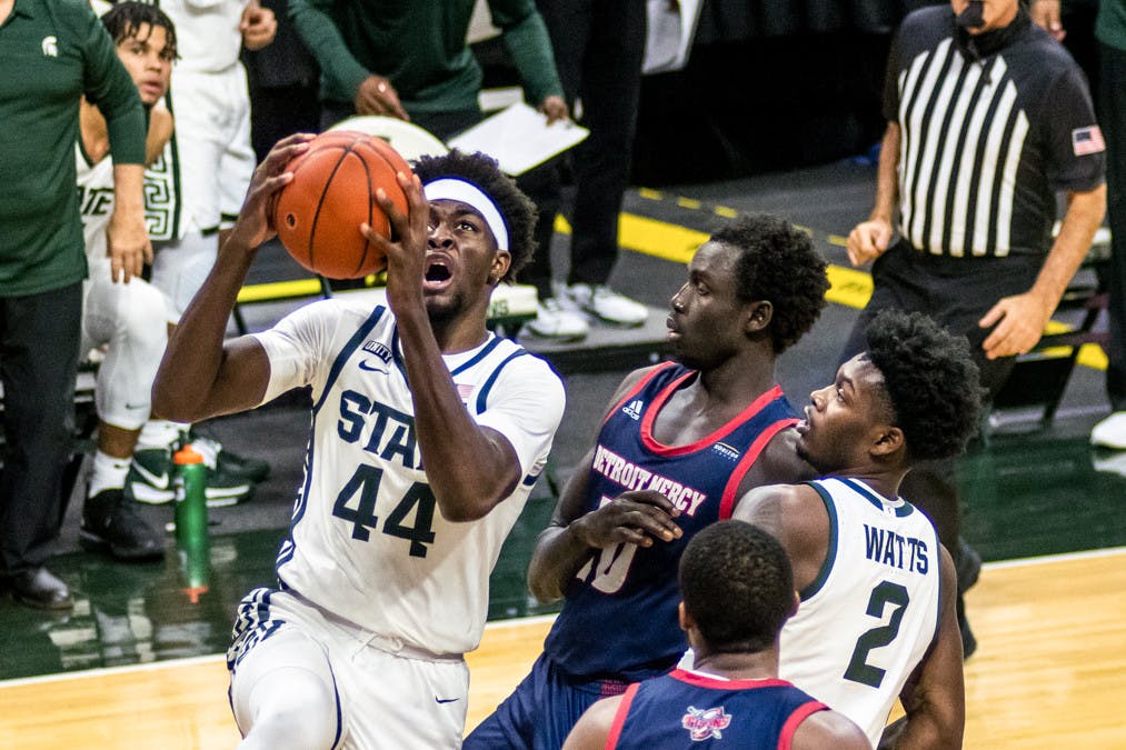 <p>Junior forward Gabe Brown (44) shoots the ball during the game against the Detroit Titans on Dec. 4, 2020 at the Breslin Center. The Spartans defeated the Titans, 83-76.</p>