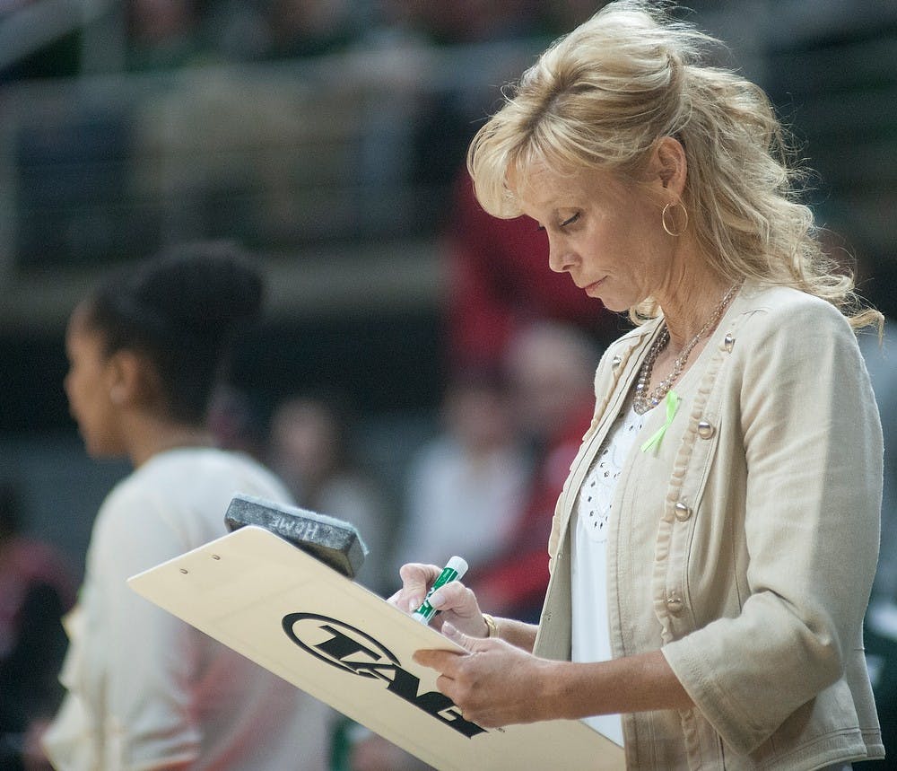 <p>Head coach Suzy Merchant draws out a play Jan. 25, 2015, during the game against Wisconsin at Breslin Center. The Spartans defeated the Badgers, 77-71. Alice Kole/The State News</p>