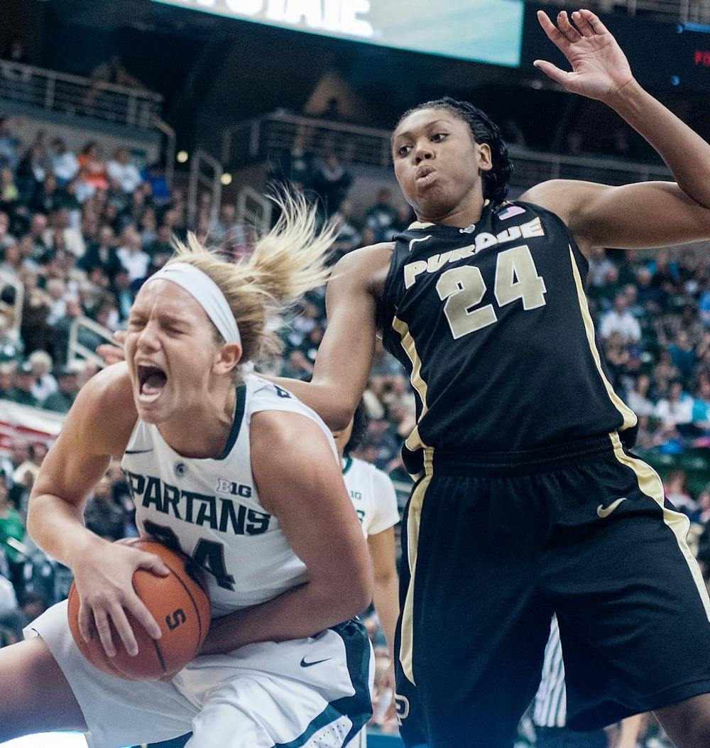	<p>Senior forward Courtney Schiffauer grabs the rebound before Purdue&#8217;s Drey Mingo on Jan. 27, 2013, at the Breslin Center. The Spartans lost, 67-62. Julia Nagy/The State News</p>
