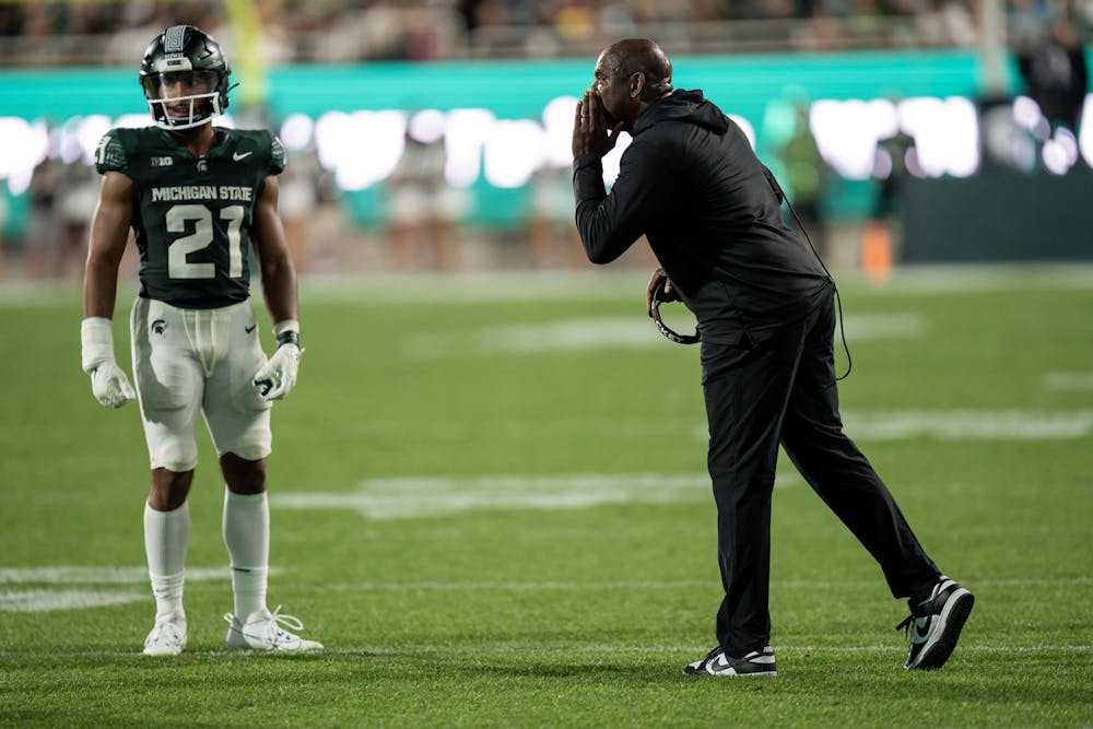 <p>Michigan State Head Football Coach Mel Tucker passes a message to Defensive Back Dillon Tatum during his win over Central Michigan on September 1st, 2023.</p>