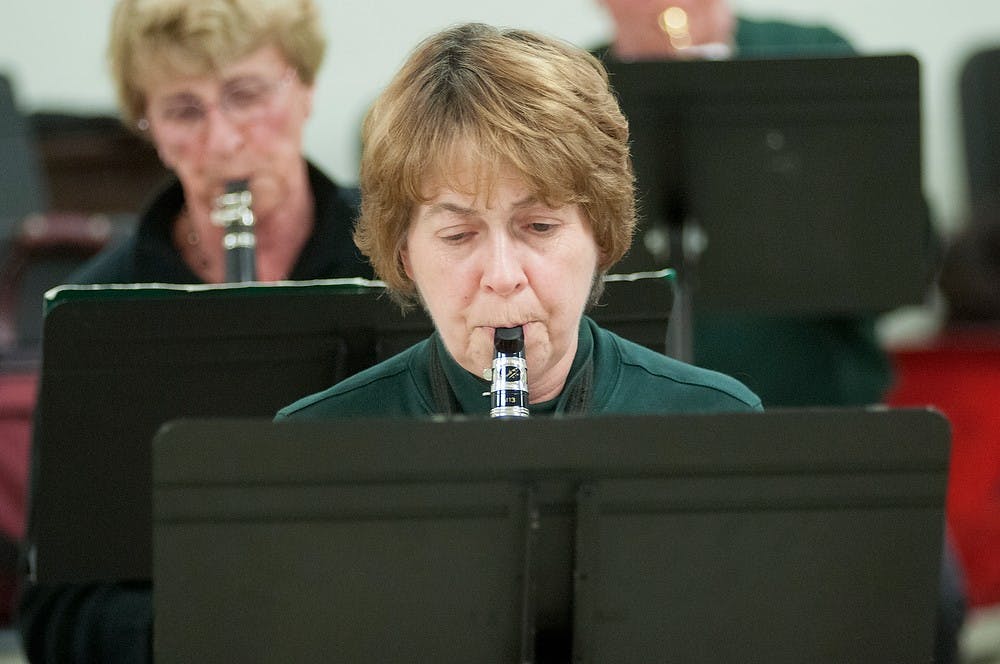 	<p>Lansing resident Kate Marsh plays her clarinet Monday, Nov. 12, 2012, at the <span class="caps">MSU</span> Community Music School. Marsh was participating in a rehearsal for New Horizons, a group of adults who came together to learn and perform their instruments. James Ristau/The State News</p>