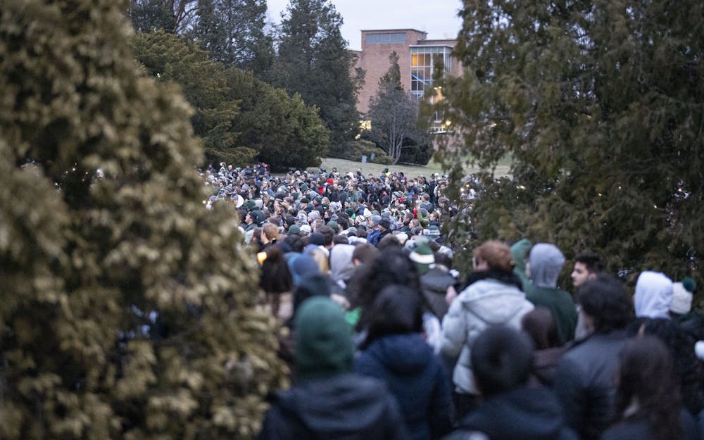<p>Thousands gathered at the Rock on Farm Lane on Wednesday, Feb. 15, 2023, to remember Brian Fraser, Alexandria Verner and Arielle Anderson, the three victims of Michigan State University’s mass shooting on Feb. 13.</p>