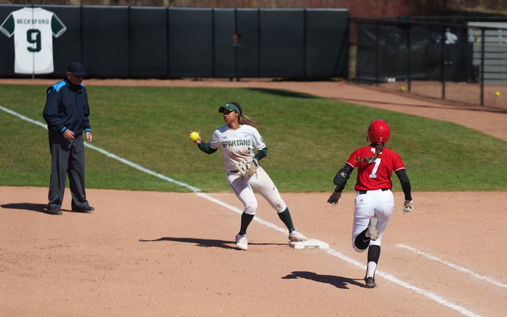 <p>Michigan State junior Camryn Wincher getting out Nebraska sophomore Sydney Gray in the first inning. Spartans lost 5-4 against Nebraska, on April 10, 2022.</p>