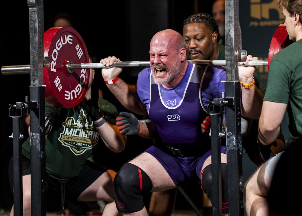 <p>Bryan Briegel squats with 187.5 kg at the 2025 USA Powerlifting Michigan State Championships in Lansing, Mich. on Nov. 23, 2025.</p>
