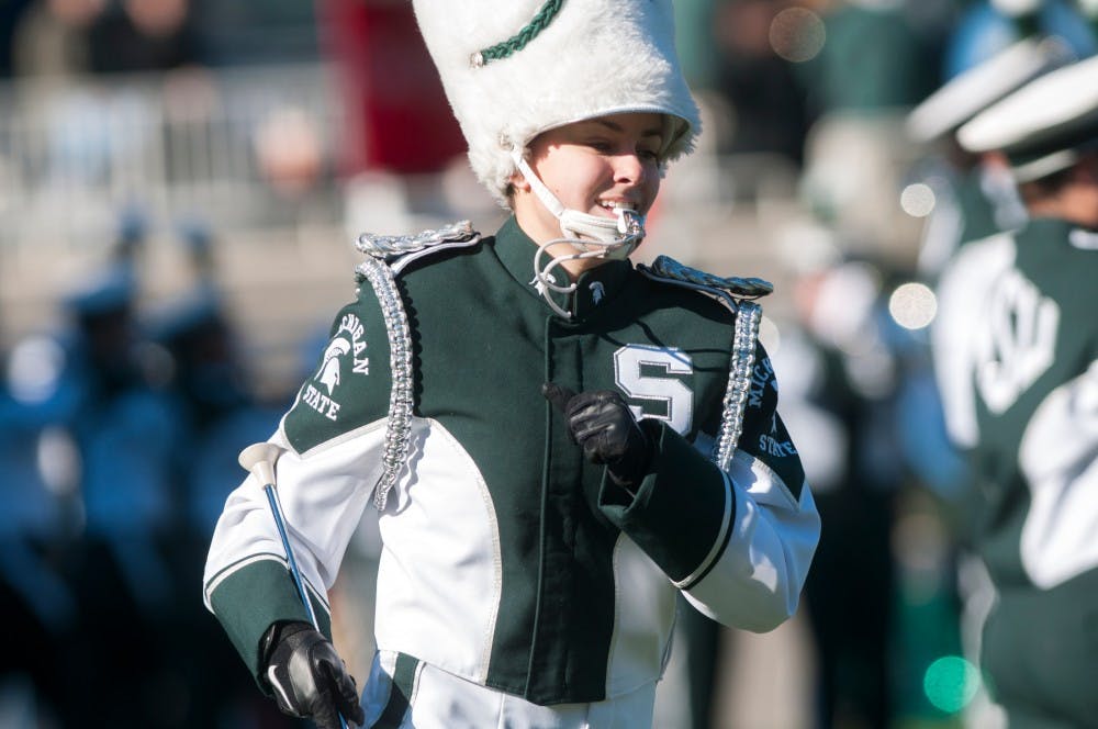 Senior drum majorette Shannon Black leads the Spartan Marching Band in the pregame performance before the home football game against Maryland on Nov. 14, 2015 at Spartan Stadium. Black is the third female to lead the Spartan Marching Band in MSU history. 