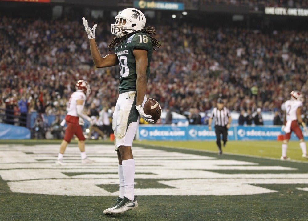 <p>Michigan State's Felton Davis III celebrates after scoring on a 49-yard pass play during the second quarter against Washington State in the Holiday Bowl at SDCCU Stadium in San Diego on Thursday, Dec. 28, 2017. (Hayne Palmour IV/San Diego Union-Tribune/Tribune News Service)</p>