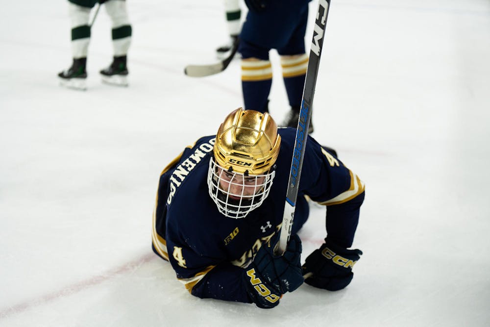 <p>Notre Dame junior defenseman Michael Mastrodomenico (4) falls to the ice at Munn Ice Arena on March 15, 2025. The Spartans took a 1-0 victory over the Fighting Irish, advancing to the Big Ten Championship.</p>