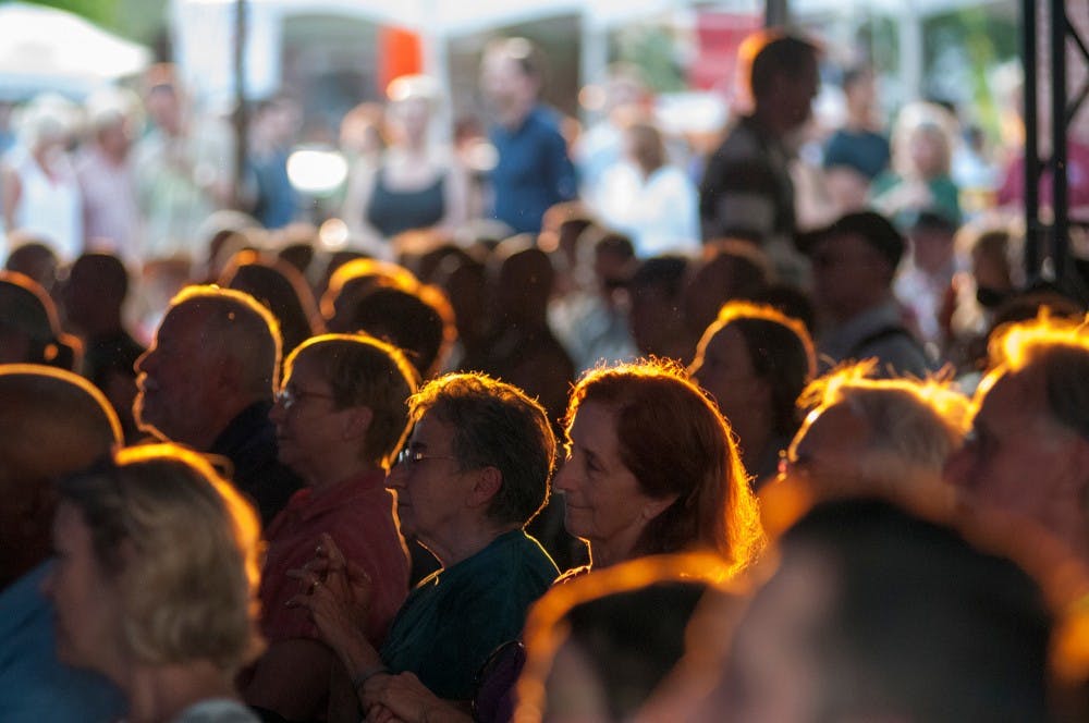 Members of the audience sit and listen to jazz on June 21, 2013 at the Summer Solstice Jazz Festival in downtown East Lansing. Hundreds attended the two-day event was organized by City of East Lansing, Wharton Center, and MSU College of Music. 