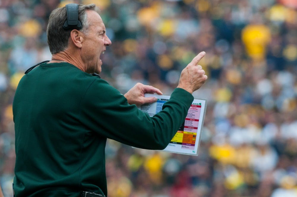 Head coach Mark Dantonio yells at the players during a time out during the game against Michigan on Oct. 29, 2016 at Spartan Stadium. The Spartans were defeated by the Wolverines, 32-23.