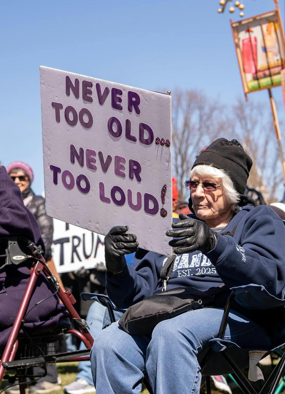 <p>A protestor holds up a sign during the No Kings Protest at the Michigan State Capitol in Lansing, MI on March 28, 2026.</p>