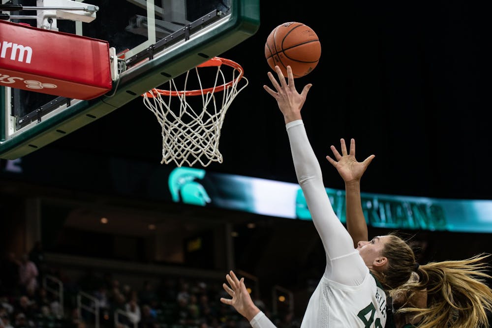 Sophomore forward Kayla Belles (42) lays up a ball during the game against Eastern Michigan Nov. 5, 2019 at the Breslin Center.