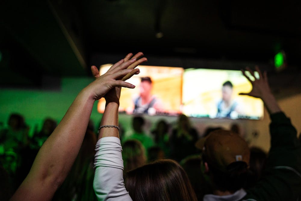 <p>Fans hold hands while watching an intense moment during the NCAA men’s basketball tournament regional semifinal game between Michigan State and UConn at Fieldhouse in East Lansing, Michigan on Friday, March 27, 2026.</p>