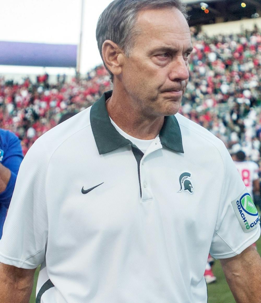 	<p>Head coach Mark Dantonio congratulates Ohio State team members after the game Saturday, Sept. 29, 2012 at Spartan Stadium. The <span class="caps">MSU</span> football team lost a close game to the Buckeyes by a score of 17-16 in the first Big Ten conference game of the season. Adam Toolin/The State News.</p>