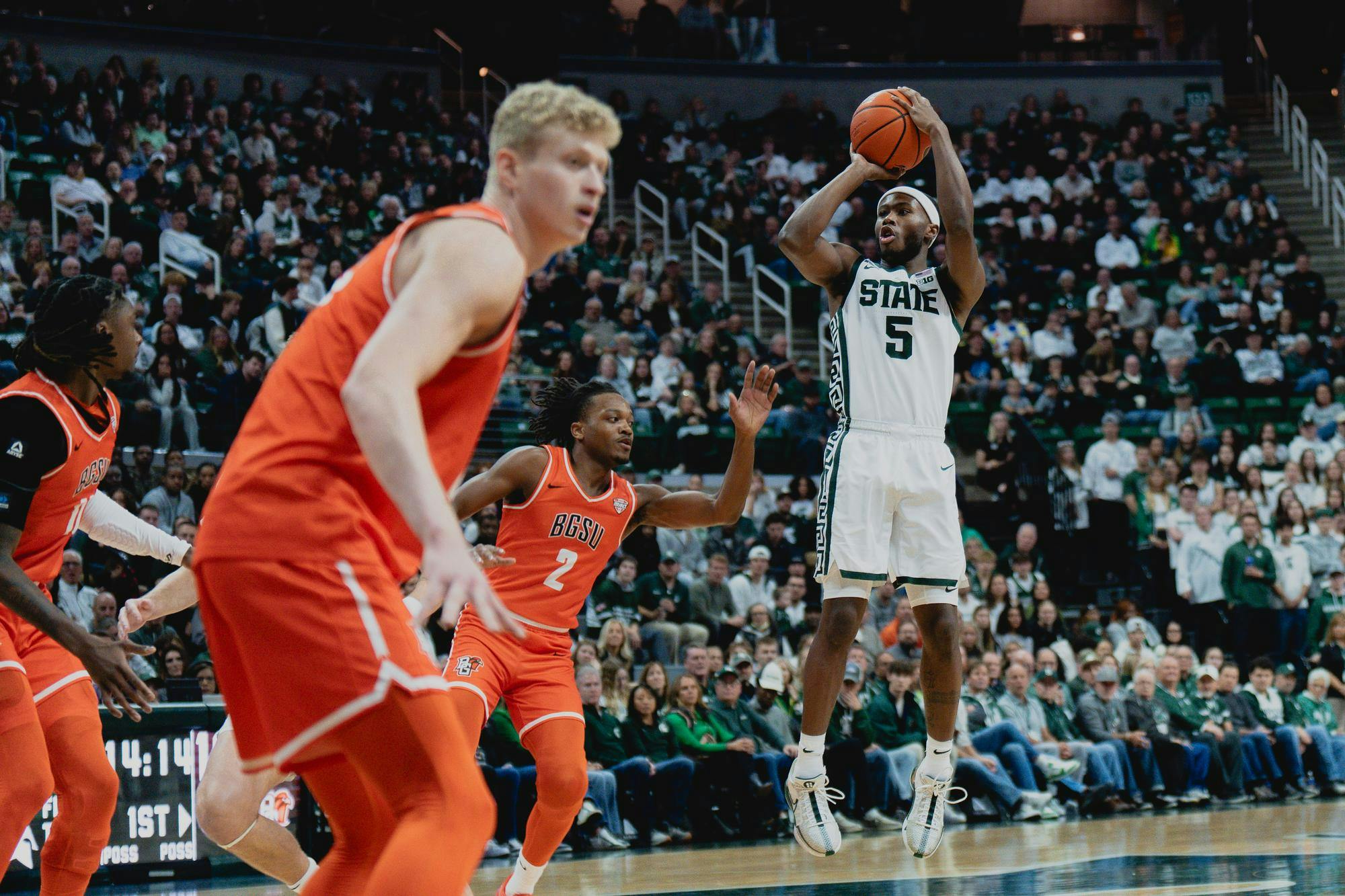 <p>MSU junior guard Tre Holloman (5) knocks down a jumpshot in a game against Bowling Green at the Breslin center on Nov. 16, 2024.</p>