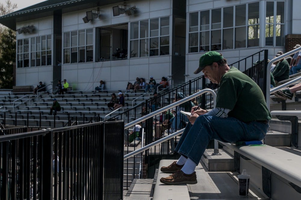Detroit resident Brian Pushie takes notes during the game against Nebraska on May 9, 2016 at McLane Stadium. The Spartans were defeated by the Cornhuskers, 7-4.
