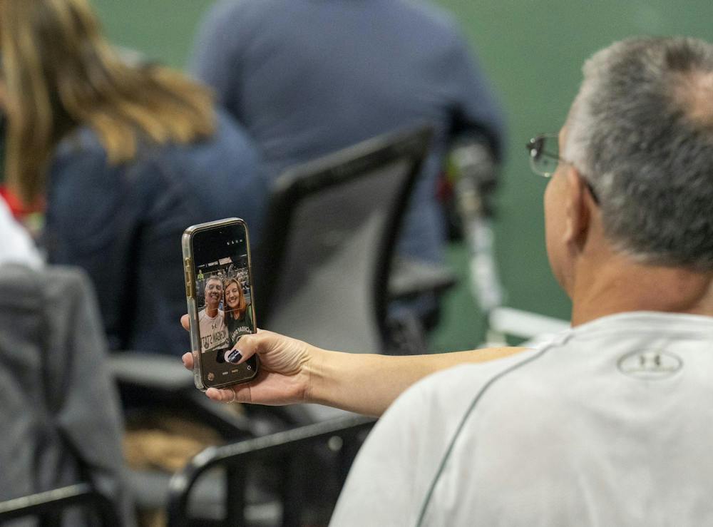 Fans take a picture at the Breslin Center during the MSU v Pennstate Volleyball game In East Lansing, MI on Sunday Sep. 27th, 2026