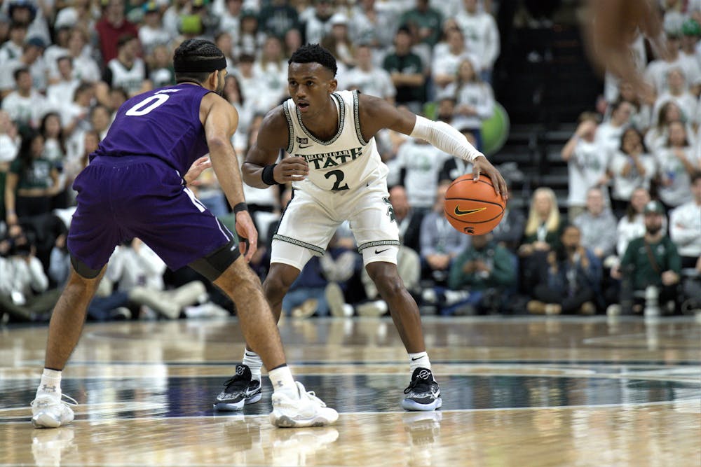 <p>Spartan ﻿guard Tyson Walker dribbles the ball during the match against the Northwestern Wildcats on Dec. 4, 2022.</p>