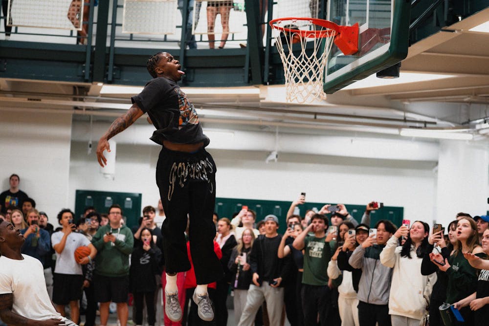 <p>Michigan State sophomore forward Coen Carr dunks the ball at IM East on April 16, 2025. The men's basketball team showed off their skills during pickup runs for students to watch.</p>