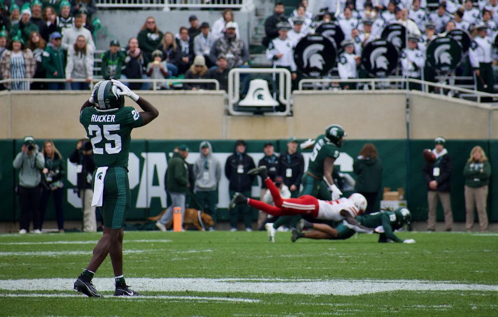Defensive back Chance Rucker (25) holds his head watching a play against Nebraska at Spartan Stadium on Nov. 4, 2023. The Spartans defeated the Cornhuskers 20-17.