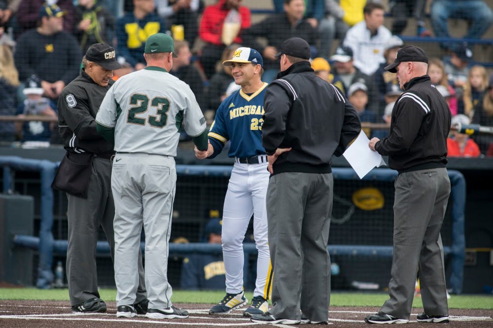 MSU head coach Jake Boss Jr. (23) shakes hands with Michigan head coach Erik Bakich (23) before the game against Michigan on April 29, 2016 at Ray Fisher Stadium at Wilpon Baseball Complex in Ann Arbor, Mich. The Spartans were defeated by the Wolverines, 4-3.